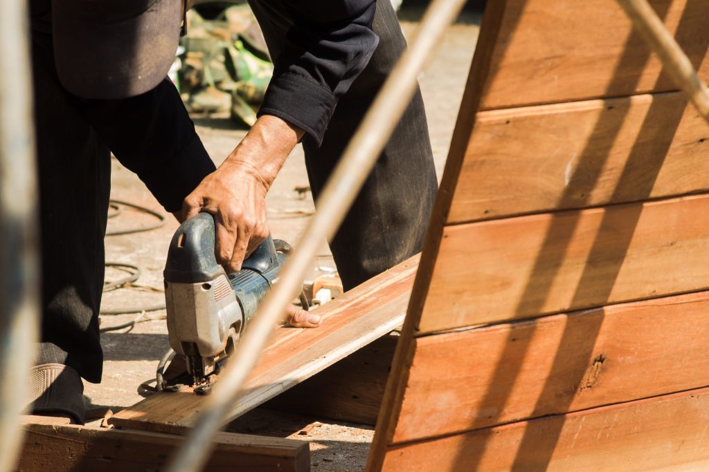 man working on wood